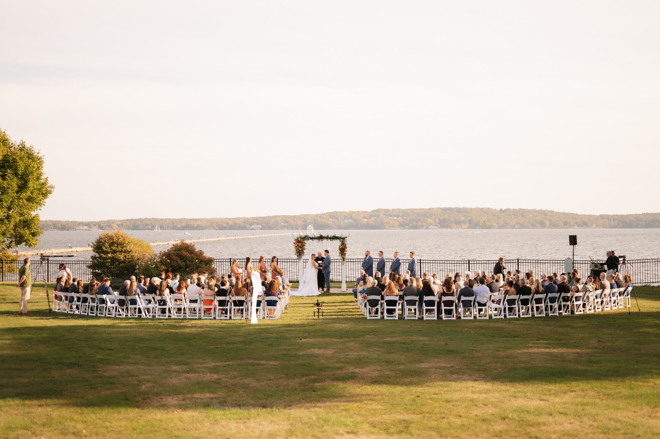 Taylor and Matthew exchanging vows at the Samoset Resort with ocean views in Rockland Maine